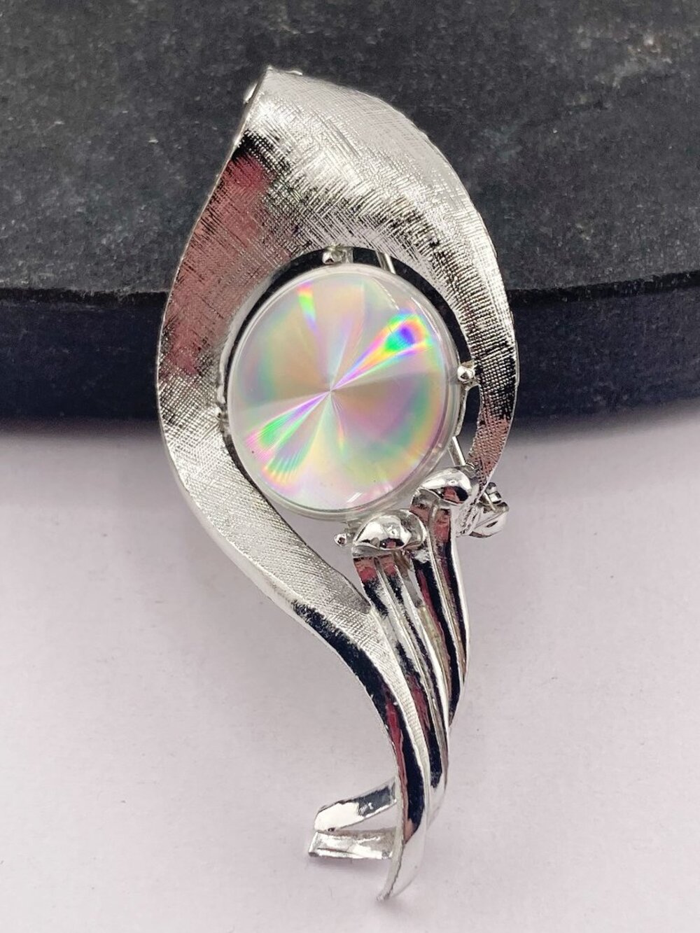 RAINBOW Brand vintage prismatic disk and silver tone metal abstract leaf brooch